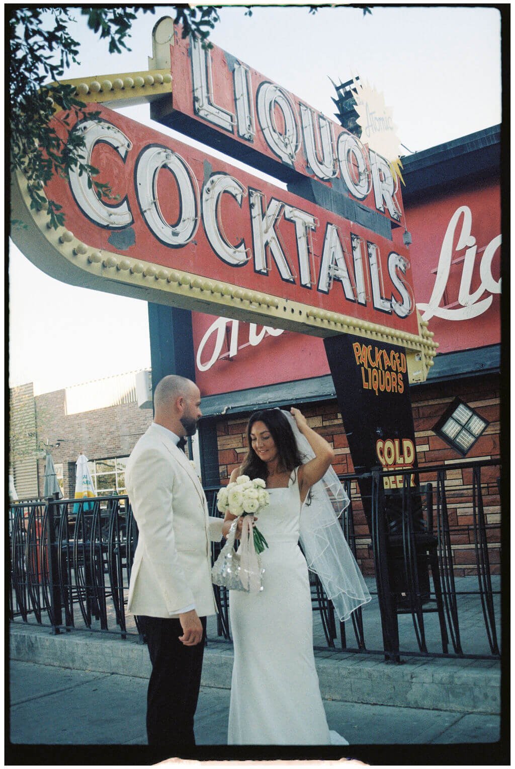 Couple at their Las Vegas Elopement in fron t of cool Vegas sign