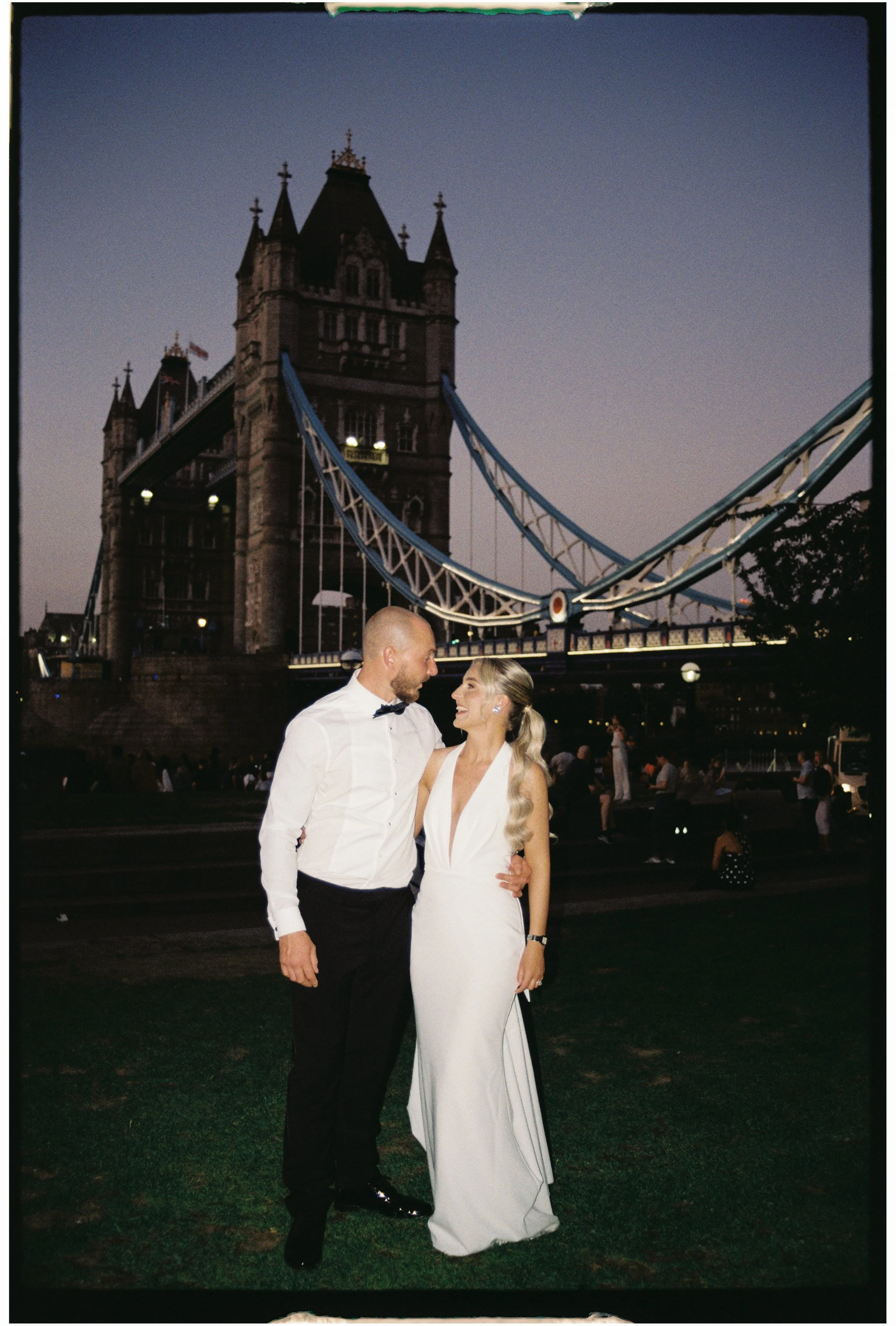 A 35mm film photo taken at dusk with Tower Bridge in the background