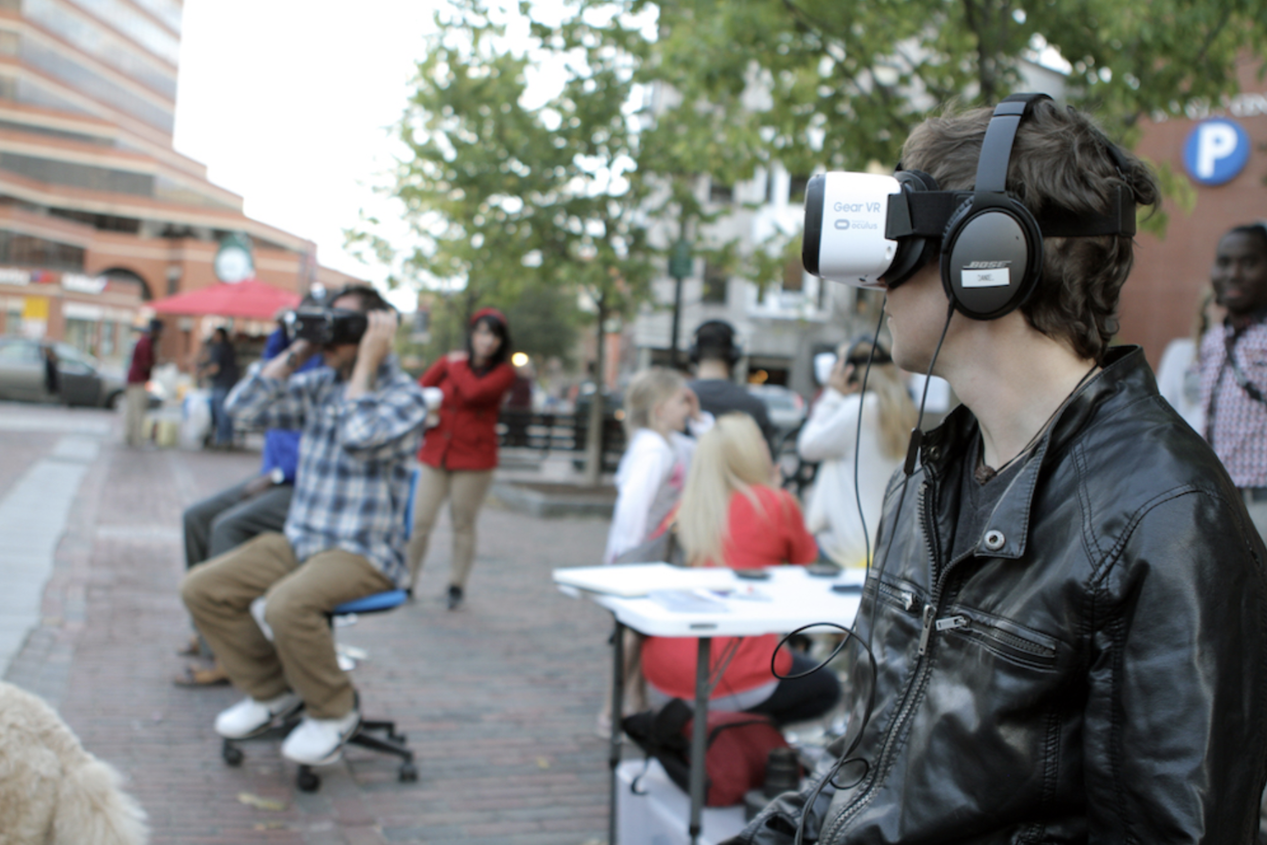 Guests experience A Shared Space at a 'sidewalk VR hub' in Portland's Monument Square....png