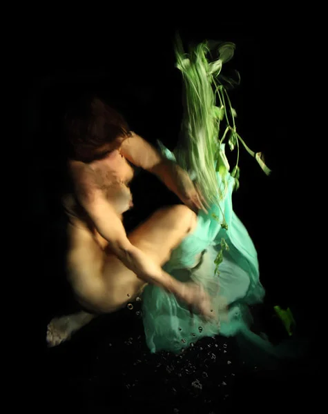 Christy Lee Rogers from her Siren collection, in a baroque, Caravaggio-like style.