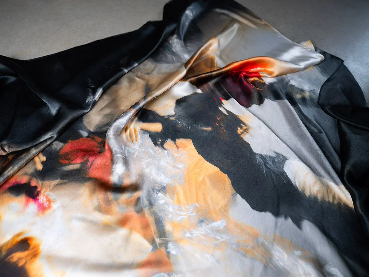 Christy Lee Rogers’ Shine silk scarf from her Muses collection captures the ethereal beauty of underwater figures, reminiscent of Renaissance masterpieces.