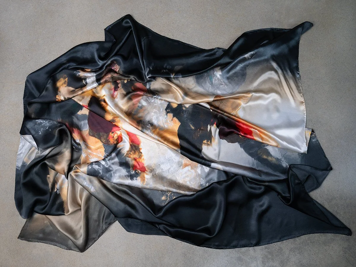 Christy Lee Rogers’ Shine silk scarf from her Muses collection captures the ethereal beauty of underwater figures, reminiscent of Renaissance masterpieces.