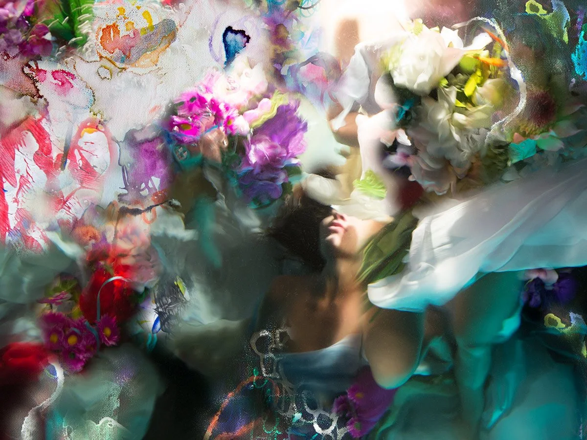 In Above and Below from the Hybrids collection, Christy Lee Rogers merges a solitary figure with drifting flowers and washes of watercolor, creating a dreamlike vision of fragility and endurance.