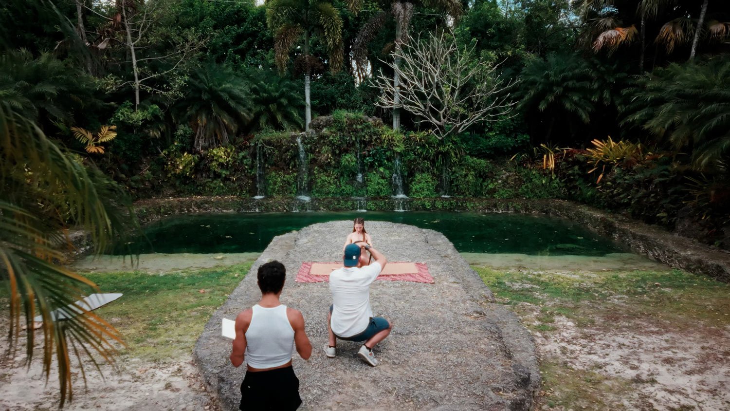 naked yoga photo shoot in tropical location with waterfalls