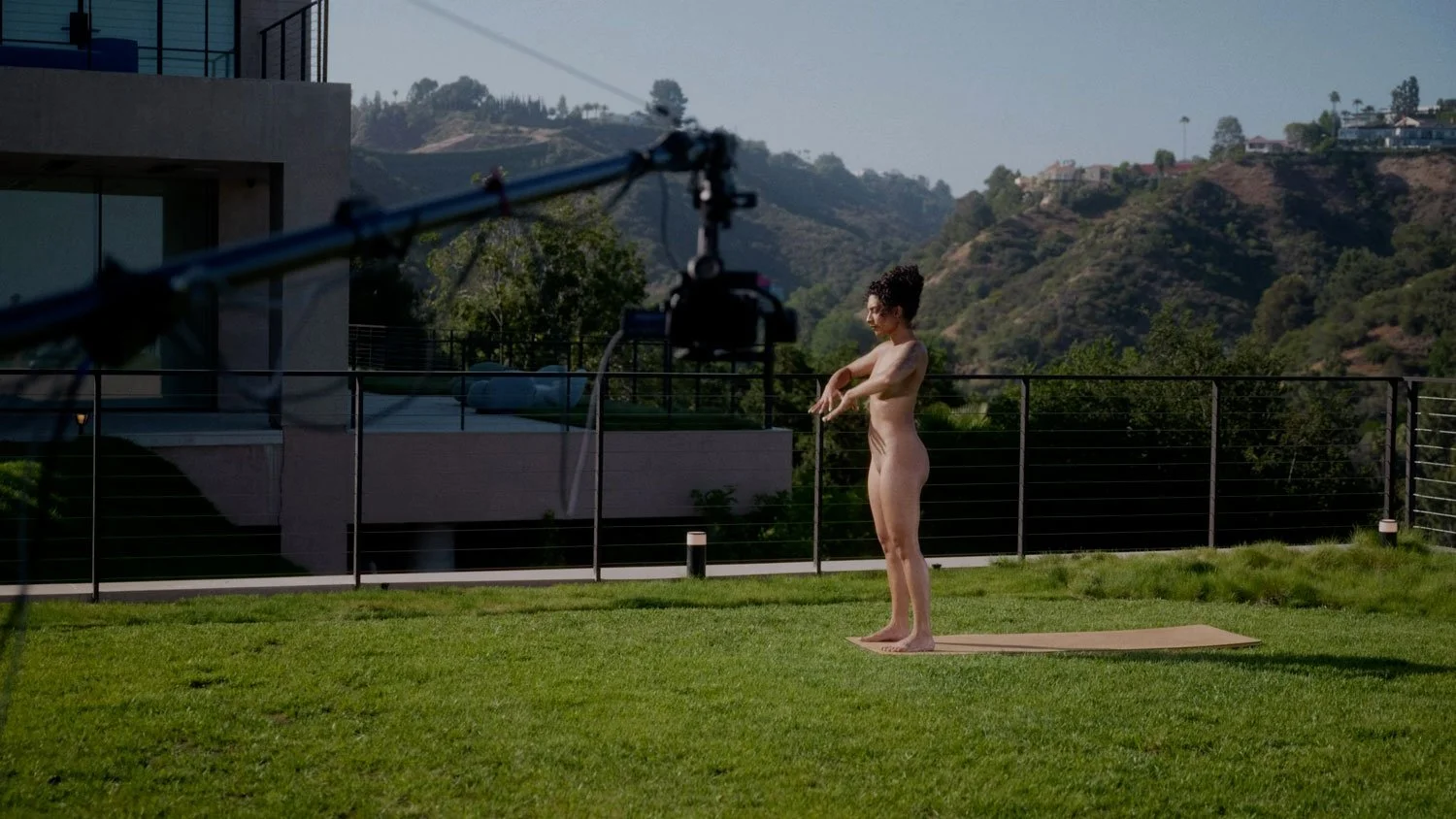 nude woman on the set of a video for naked yoga