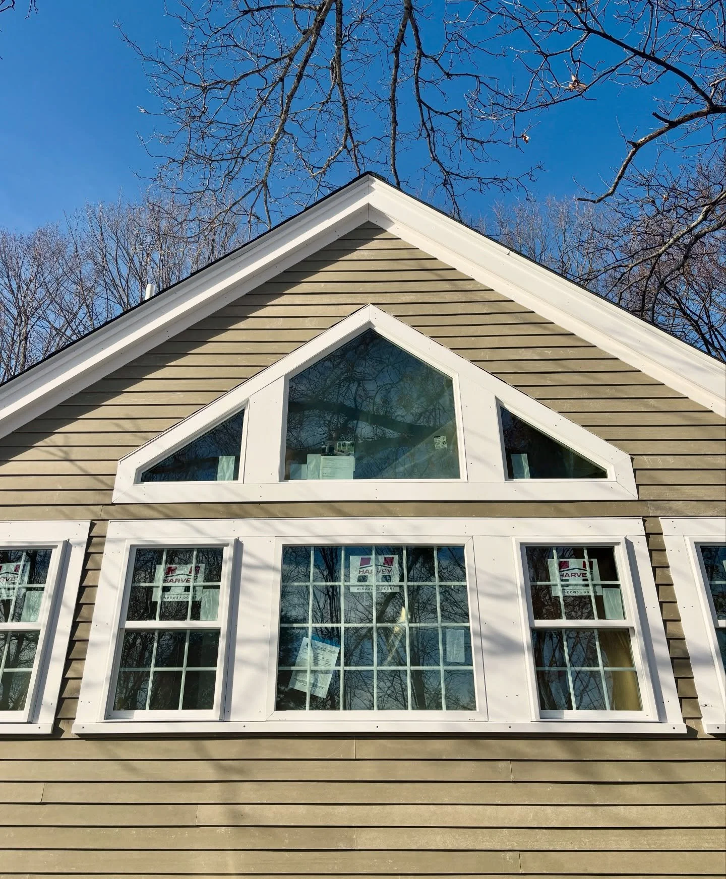 When 1882 meets 2026.

The gable wall of this addition features a pentagon window that crowns a 4' wide picture window, flanked by trapezoidal accents that mirror the roof's slope.

Blending old with new, we've matched the existing home's charm with 