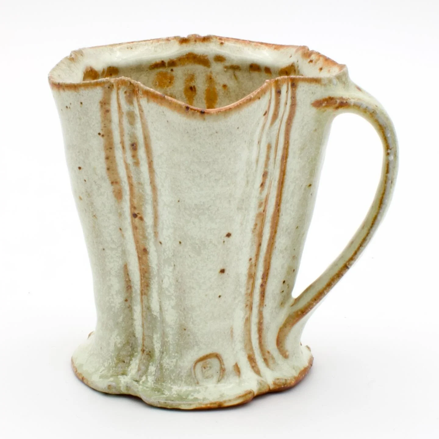 Two pairs of mugs. The first set of images is my white salt glaze that was fired to cone 12 in the @mu_ceramics catenary arch kiln over 13 hours.
The second set of images is the white salt glaze + a volcanic ash &amp; wood ash glaze that was then fir