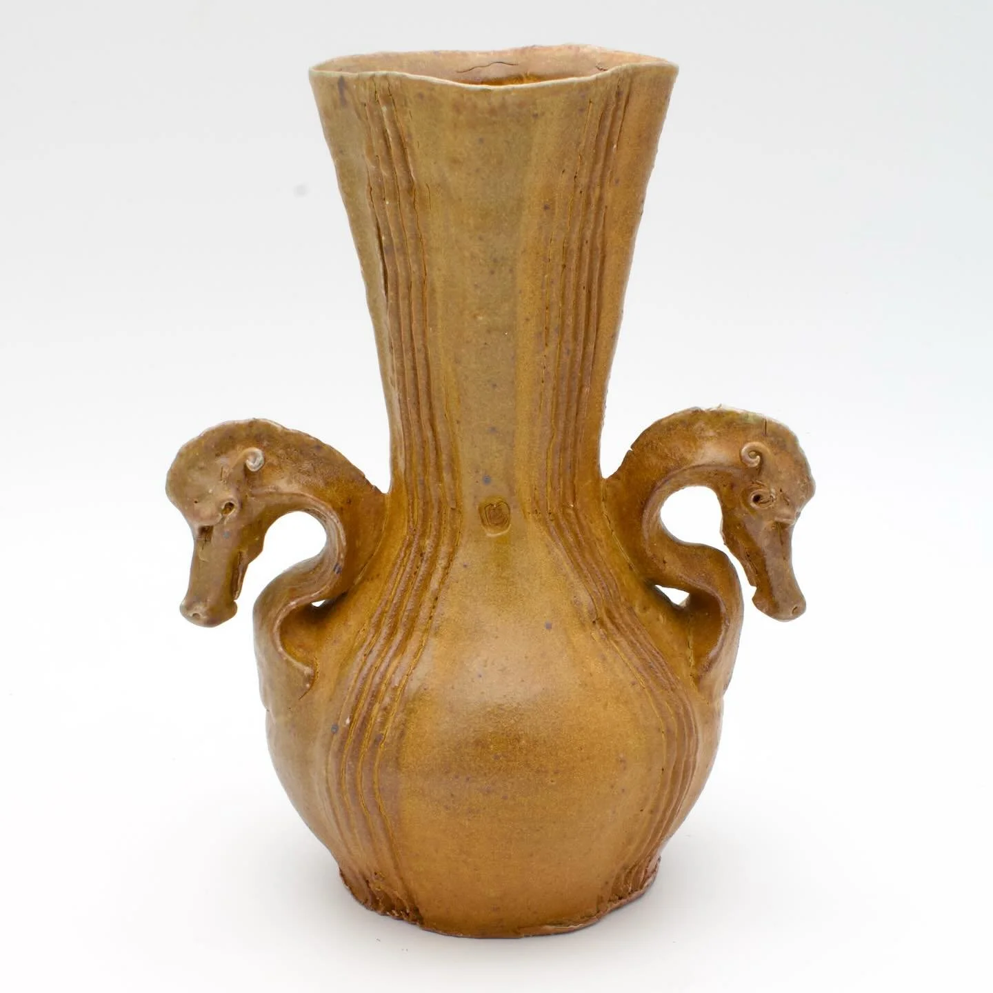 Another dragon vase from the recent @mu_ceramics soda fire! This is my old yellow flashing slip in heavy reduction. We fired the kiln pretty hot, hitting cone 12! 
I&rsquo;ve been enjoying playing with these finials on different forms 😄
.
.
.
.
.
#p