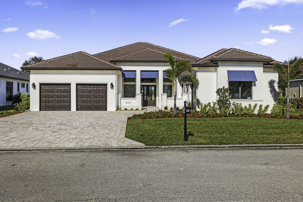 Pinnacle custom home exterior in River Hall Country Club