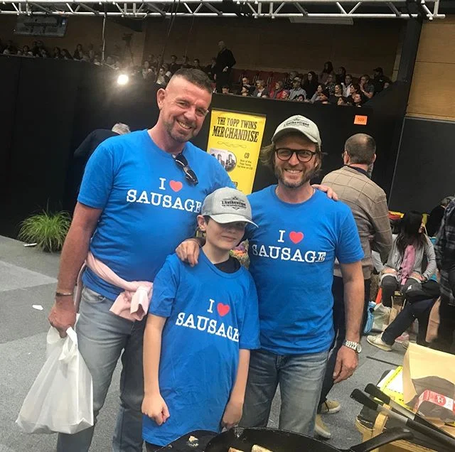 Our chief Tauranga based eleven year old sausage expert, Matthew came to see us again this year, wearing the hat Wade gave him last year.  Gems not happy about this year&rsquo;s tee.... but we are