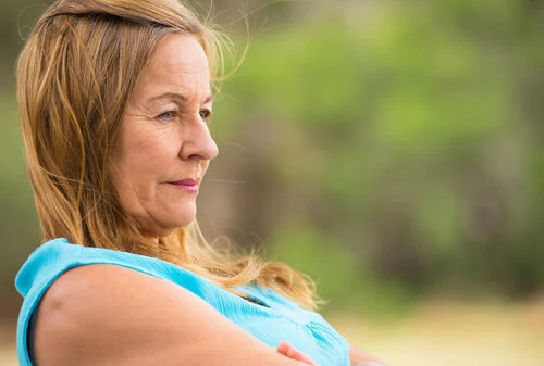 mature woman looking into distance