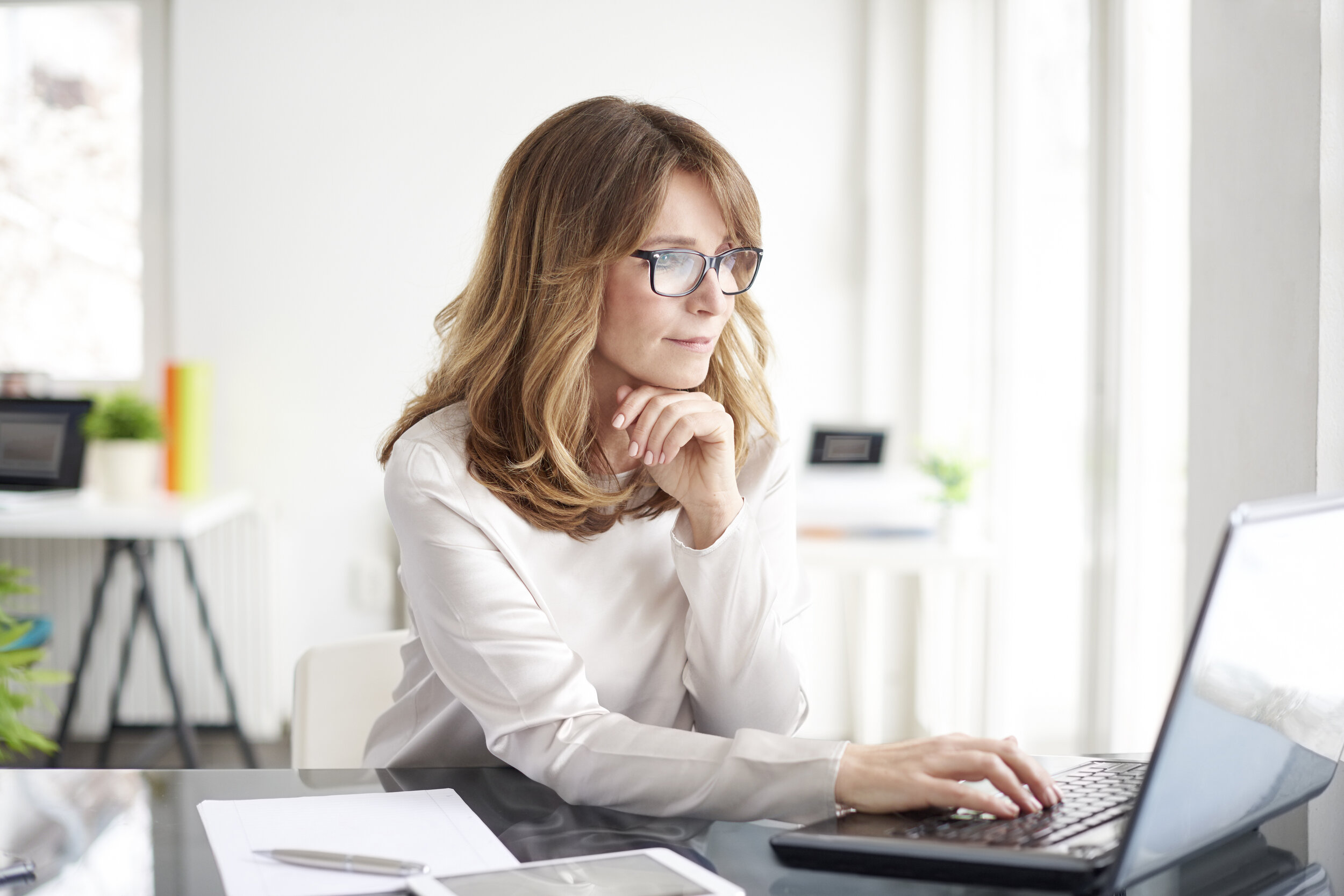 woman looking at laptop