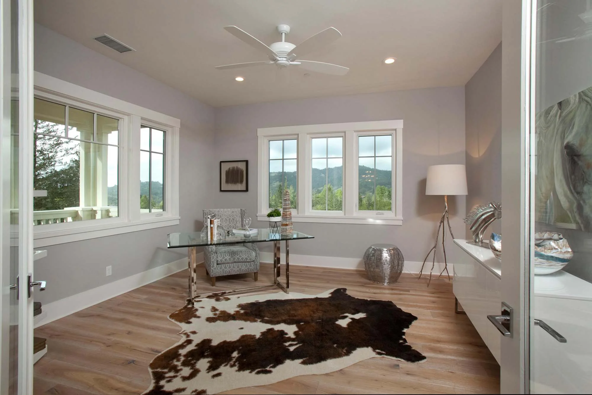Home office room with floor mattress and a lamp