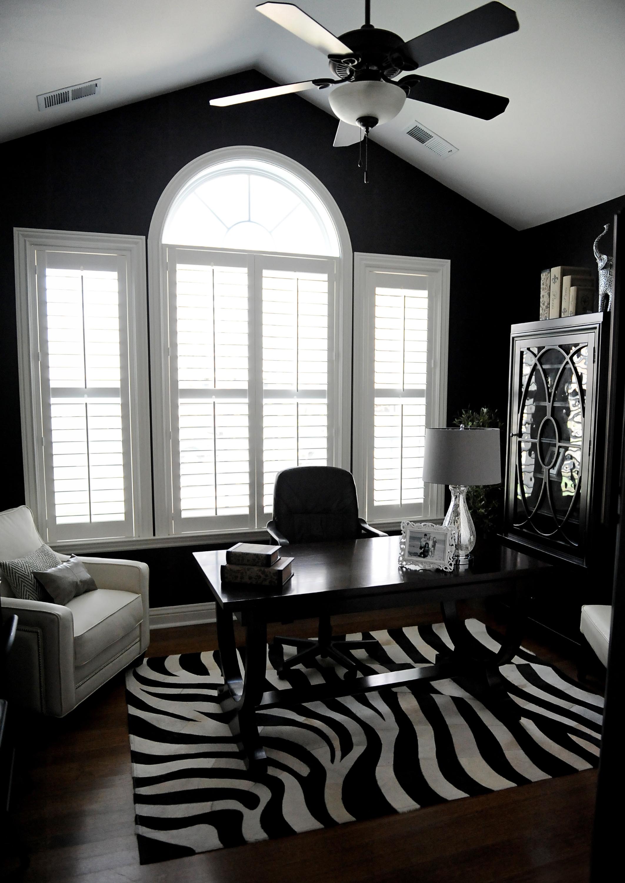 Home office with table and chair and a window