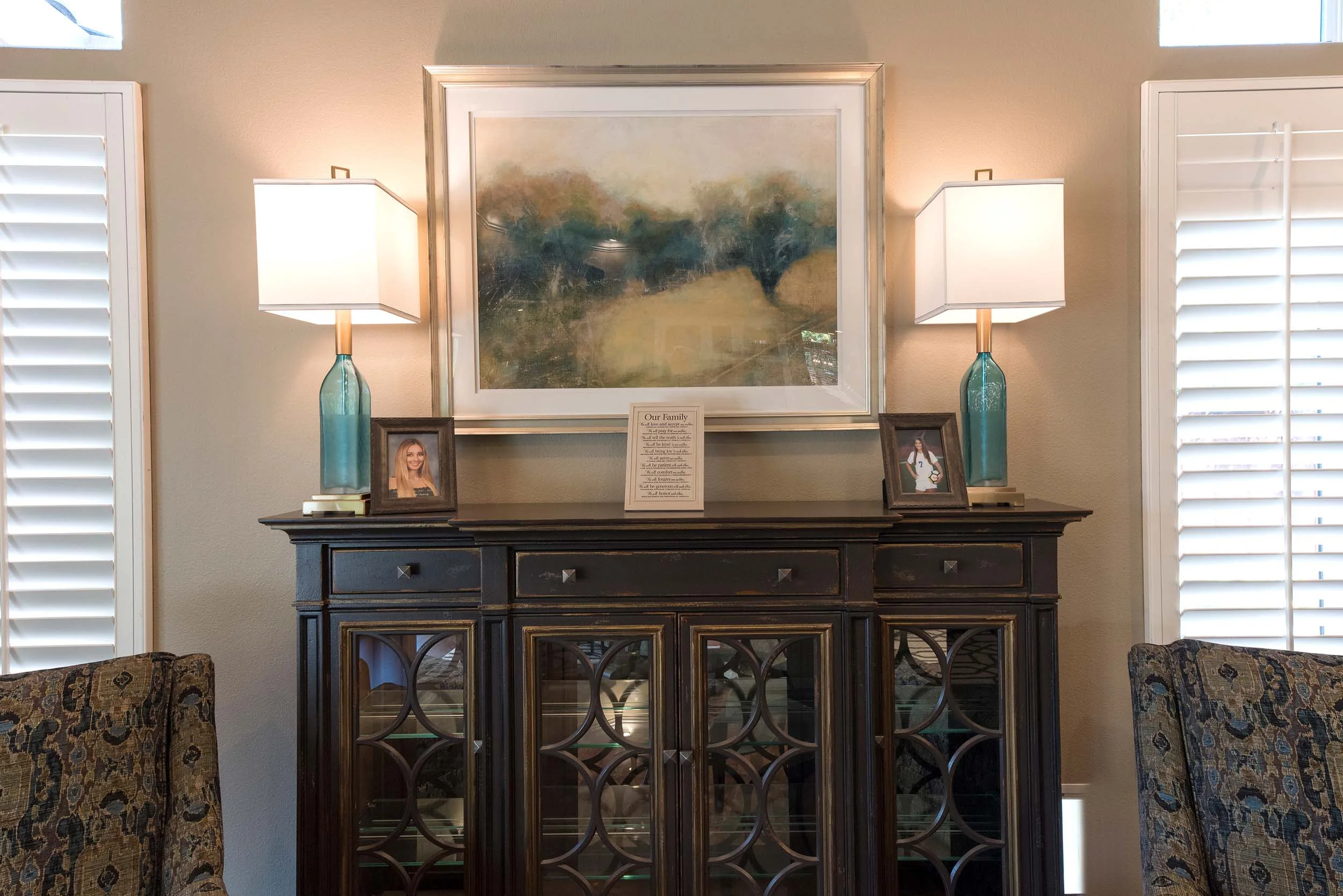 House interior with vintage drawer, table lamps and frames
