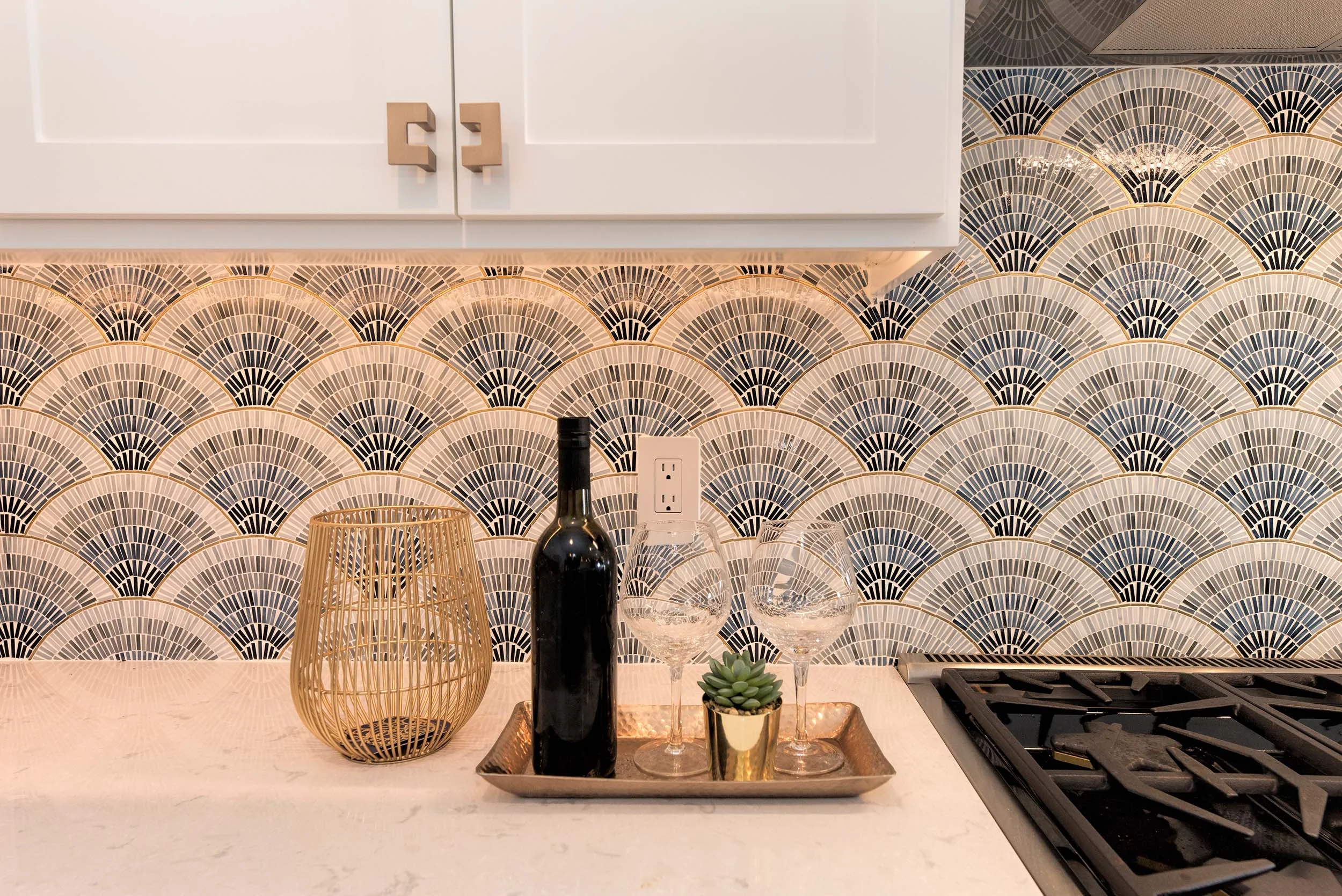 Kitchen interior with granite countertop, wine and wine glasses