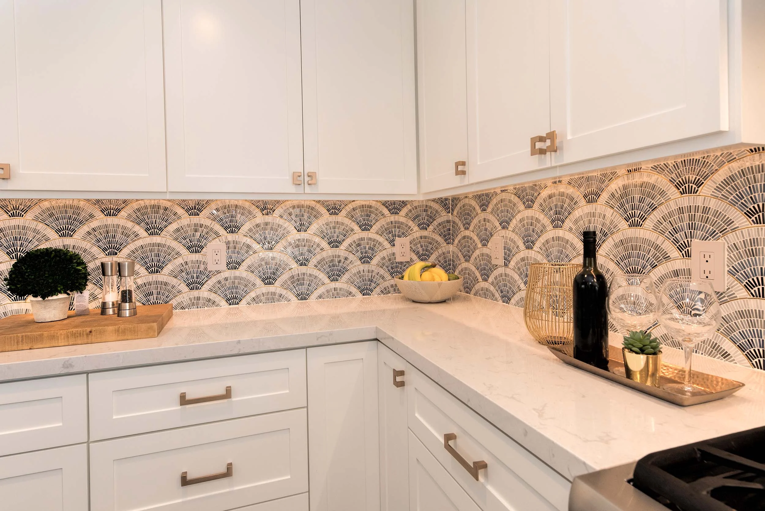 Kitchen with granite countertop, white wooden cabinet and drawer