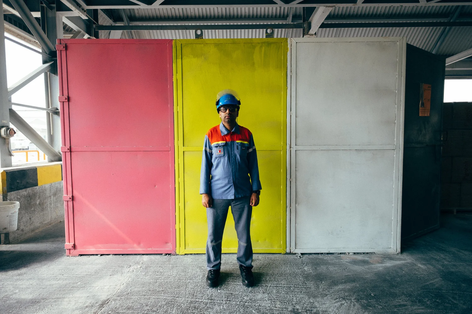 Worker standing in a factory doorway