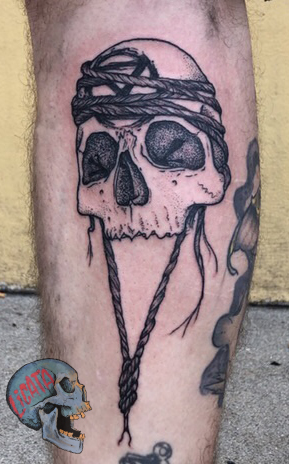 human skull extinction tattoo