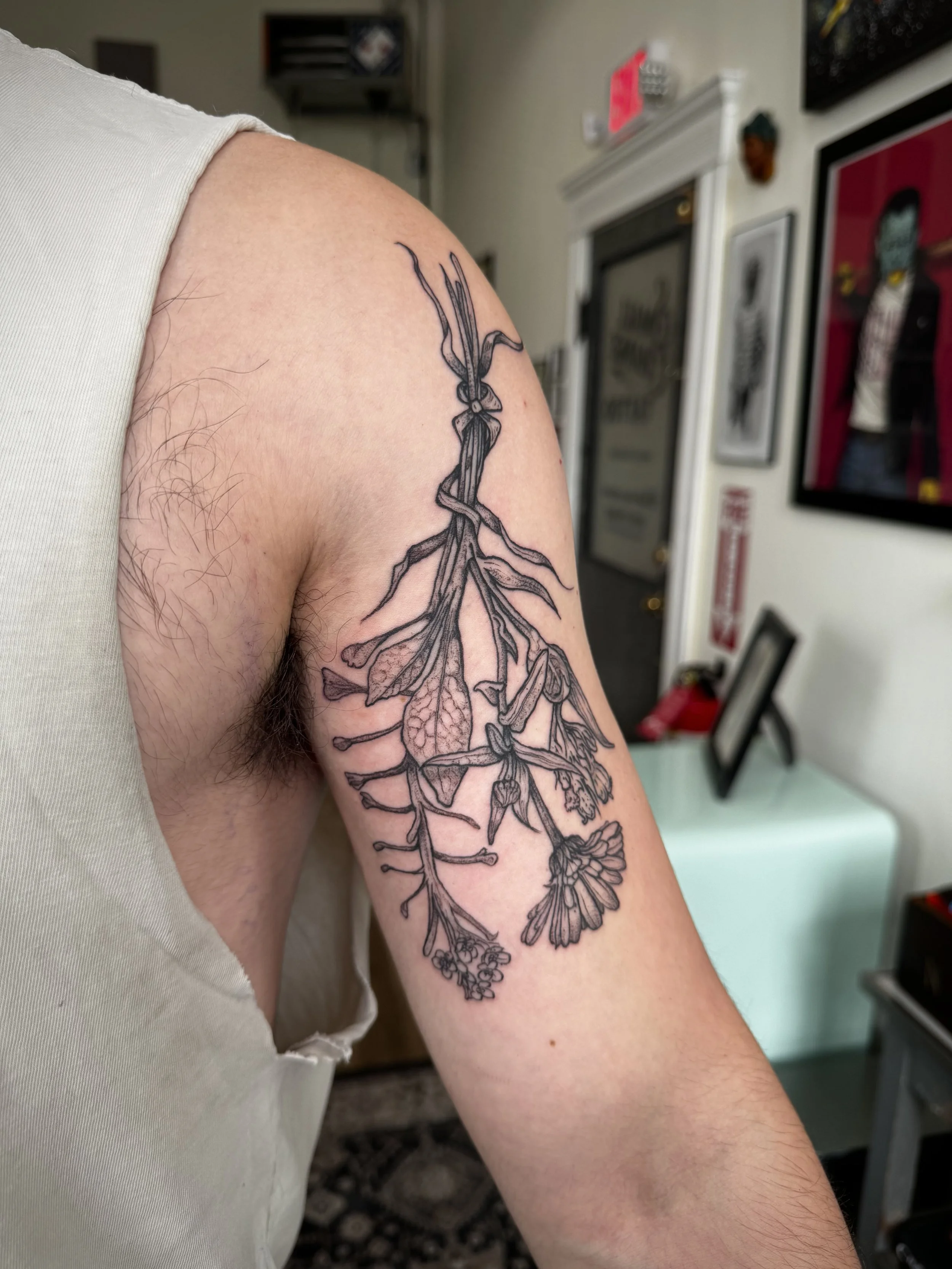 Botanical/floral arm tattoo