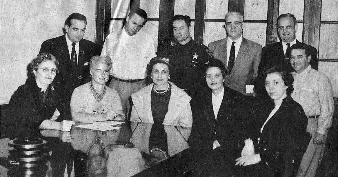 A committee responsible for the Whiting Halloween Parade, from the late 1950s or early 1960s. In the front row, left to right: Mrs. W.C. Hubbard, Laura Siebert, Mary E. Bercik, Mrs. Frank Phillippe, Mary McCord. Standing in the back row, left to right: John Petro, Fred Rader, Whiting Police Capt. Mike Skavara, John Glasheen of the Whiting Moose, Fire Chief John John J. Kostolnik, and Andy Yanas of the Community Center.