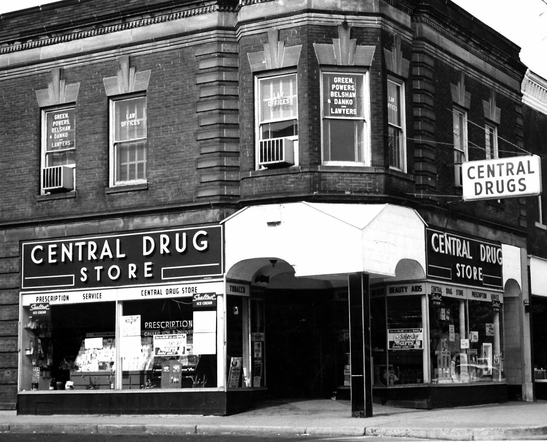 Central Drug was located at 1452 119th Street. On the second floor of this building was the law office of Green, Powers, Belshaw and Danko. The second floor of numerous downtown building were often residential apartments or offices. It was common for lawyers, doctors, dentists, music teachers, and others who needed office space, to operate on the upper floors.