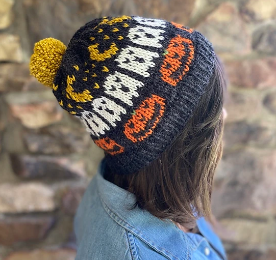 knit hat with pumpkins, ghost and moon