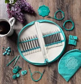 Circular knitting needles set on wooden background