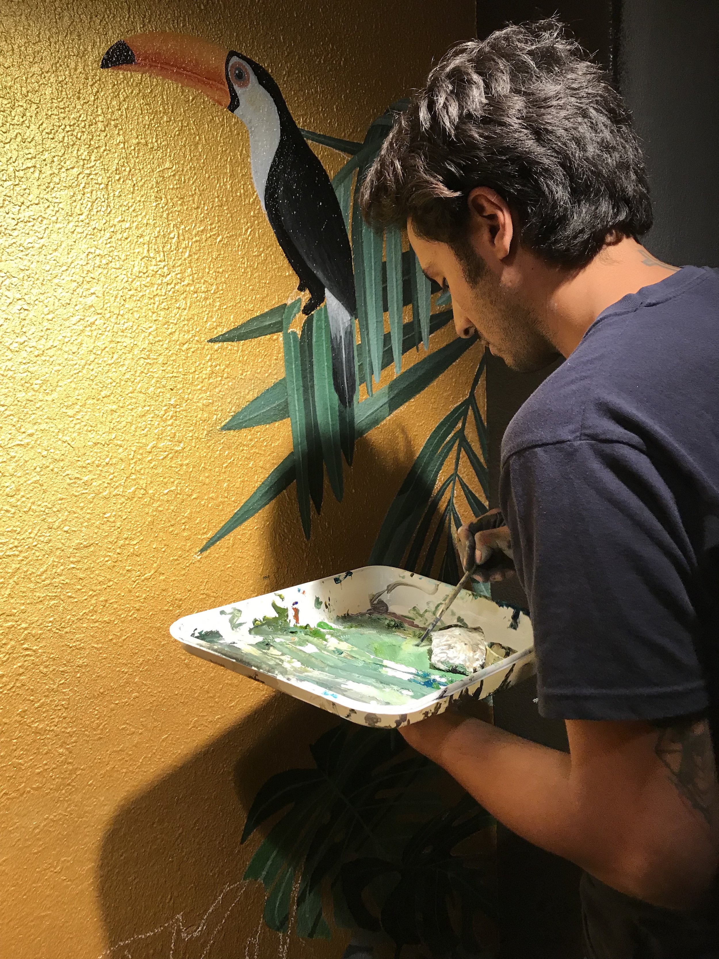 Simon painting cheetah wall.jpg