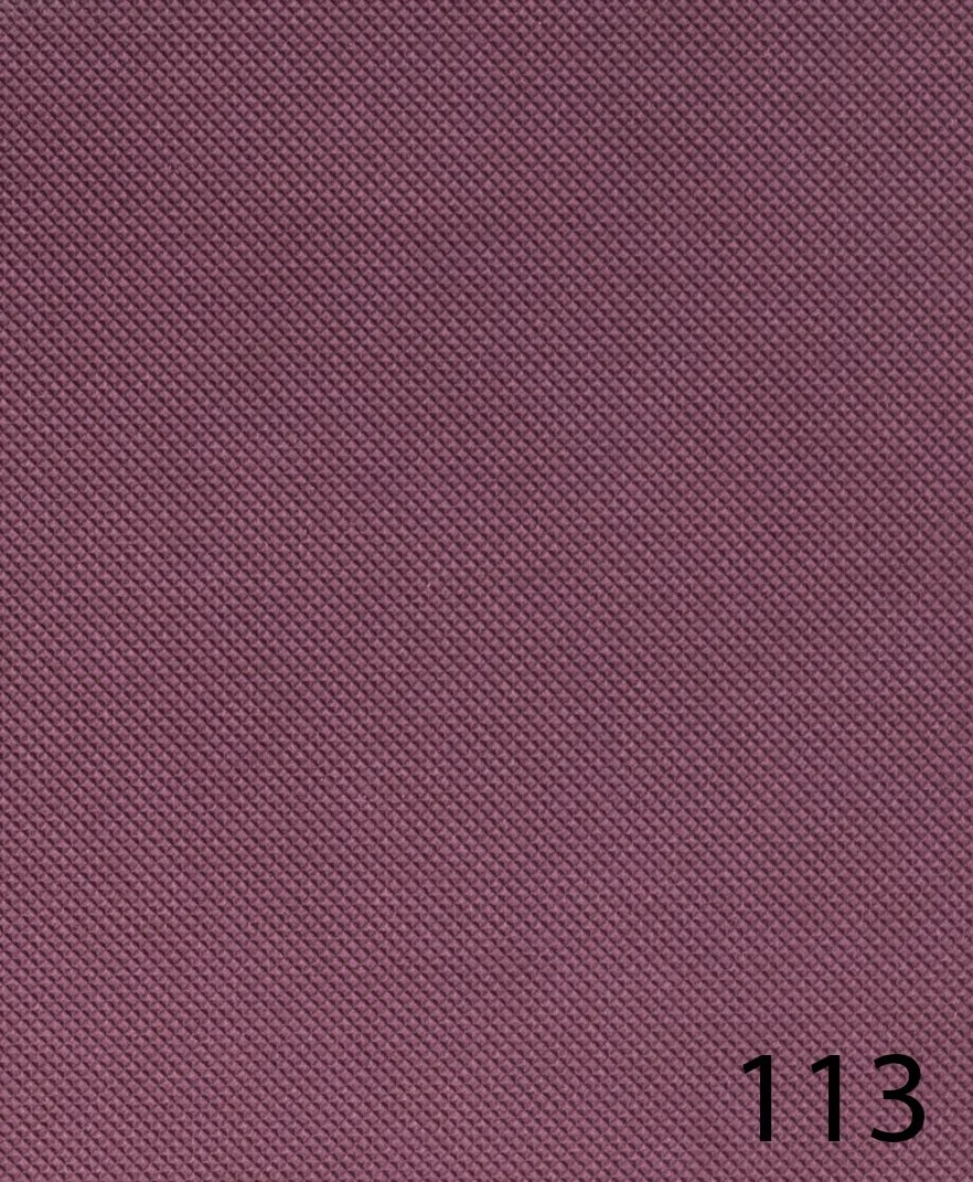 Close-up of textured pink surface with the number 113 in black at the bottom right corner.