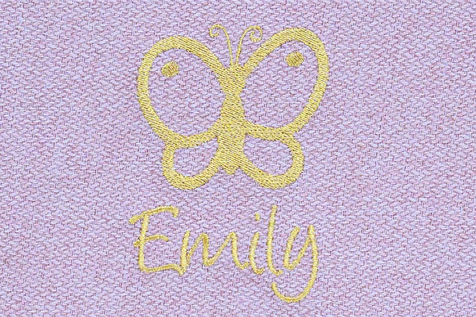Embroidery of a yellow butterfly and the name 'Emily' on pink fabric.