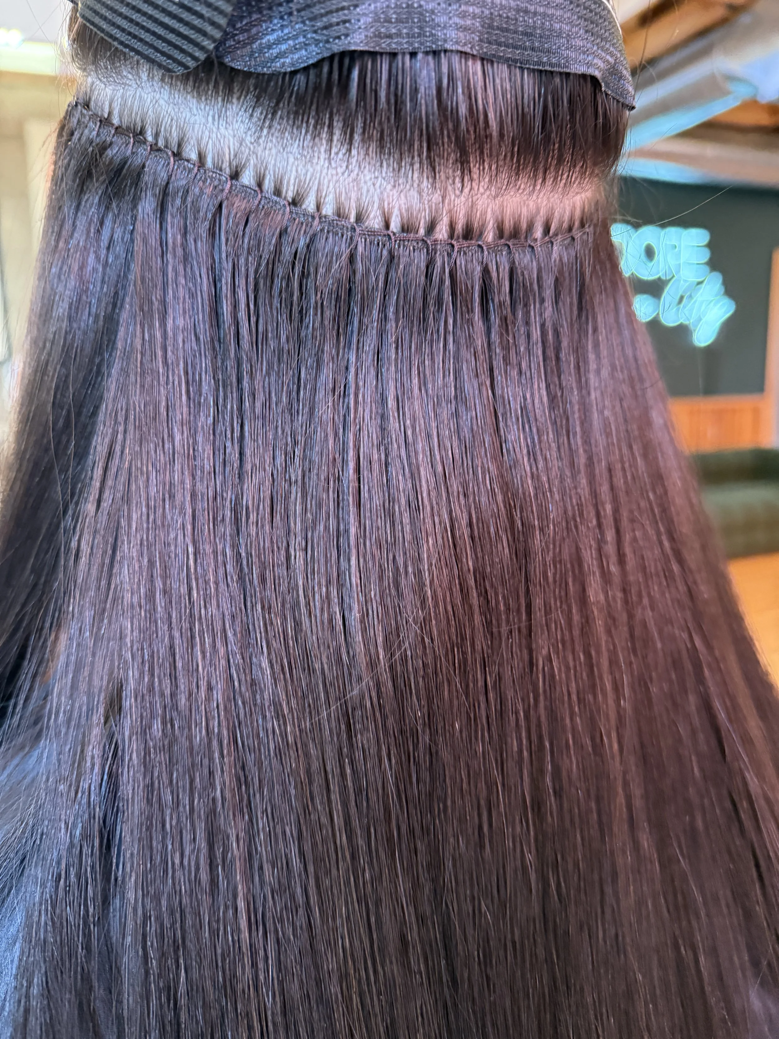 Hand sewn in machine weft hair extensions