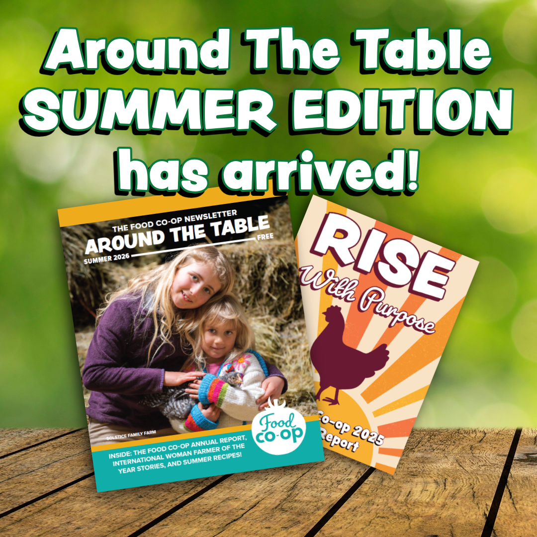Announcement for the arrival of the Spring Edition of the 'Around The Table' newsletter, featuring a background of colorful spring flowers, with a cover photo of a woman in a garden holding flowers.