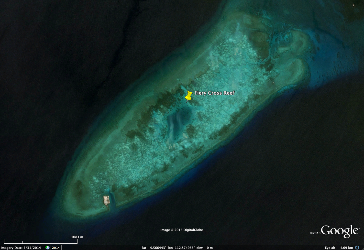  FieryCrossReef, May 31, 2014. Note the only man-made structure (small platform) at the bottom left of island. Light green and light blue areas are coral reef or adjacent habitat. Image copyright DigitalGlobe, via Google. 