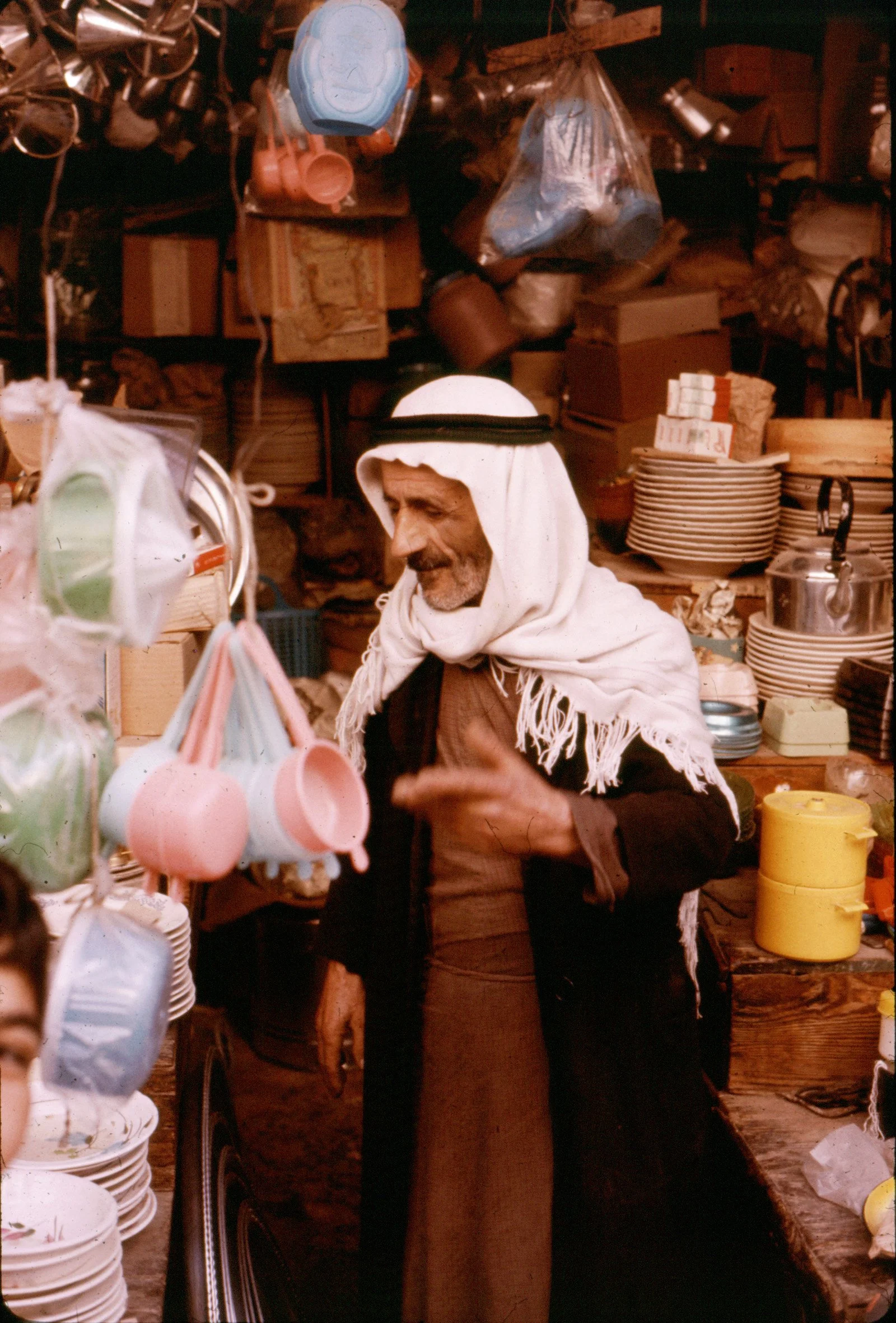 israel,man selling french plastic.jpg