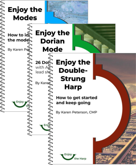 Three spiral-bound books: Enjoy the Modes, Enjoy the Dorian Mode, and Enjoy the Double-Strung Harp
