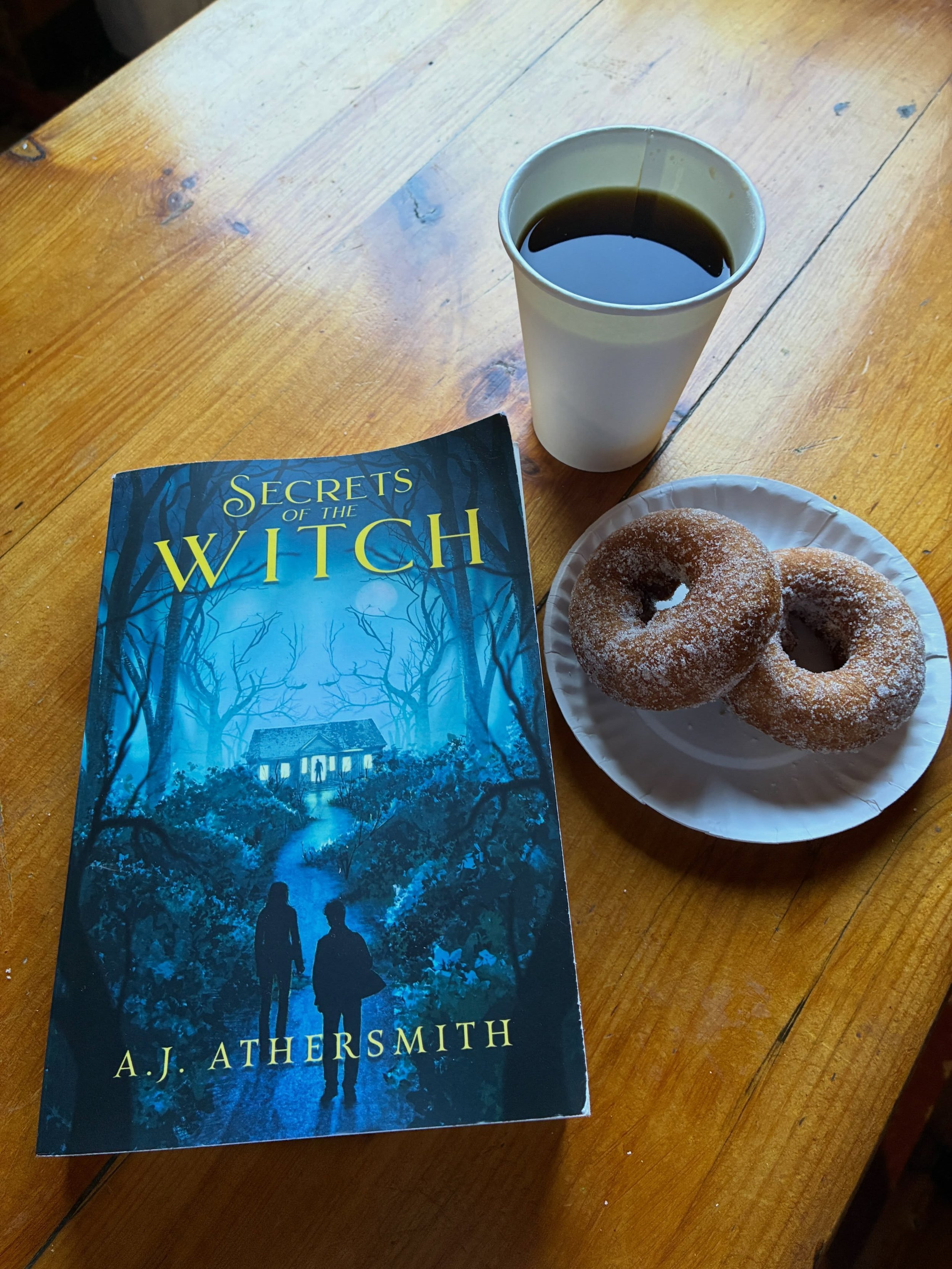 It&rsquo;s a beautiful autumn day to read a big, witchy book. 📖 🍁🎃☕️🍩