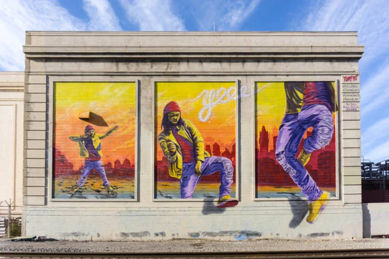 'Turfin'' mural featuring the likeness of turf dancer No Noiz aka Noh Justice by Lower Bottoms Collective as part of Oakland Mural Festival 2018. (Lina Blanco / KQED)