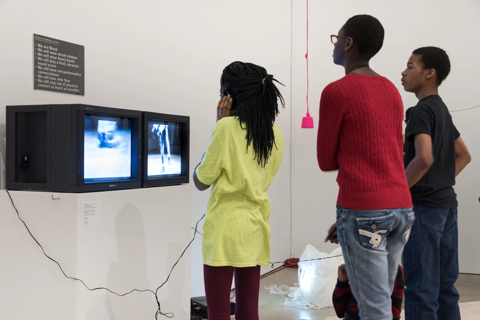 Installation of Fred Holland and Ishmael Houston-Jones footage of Untitled Duet or Oo-Ga-La (1983) on display as a part of ENDLESS SHOUT: counts orchestrate, a meadow (or weekly practice with breath) by taisha paggett at ICA Philadelphia (photographer unknown)