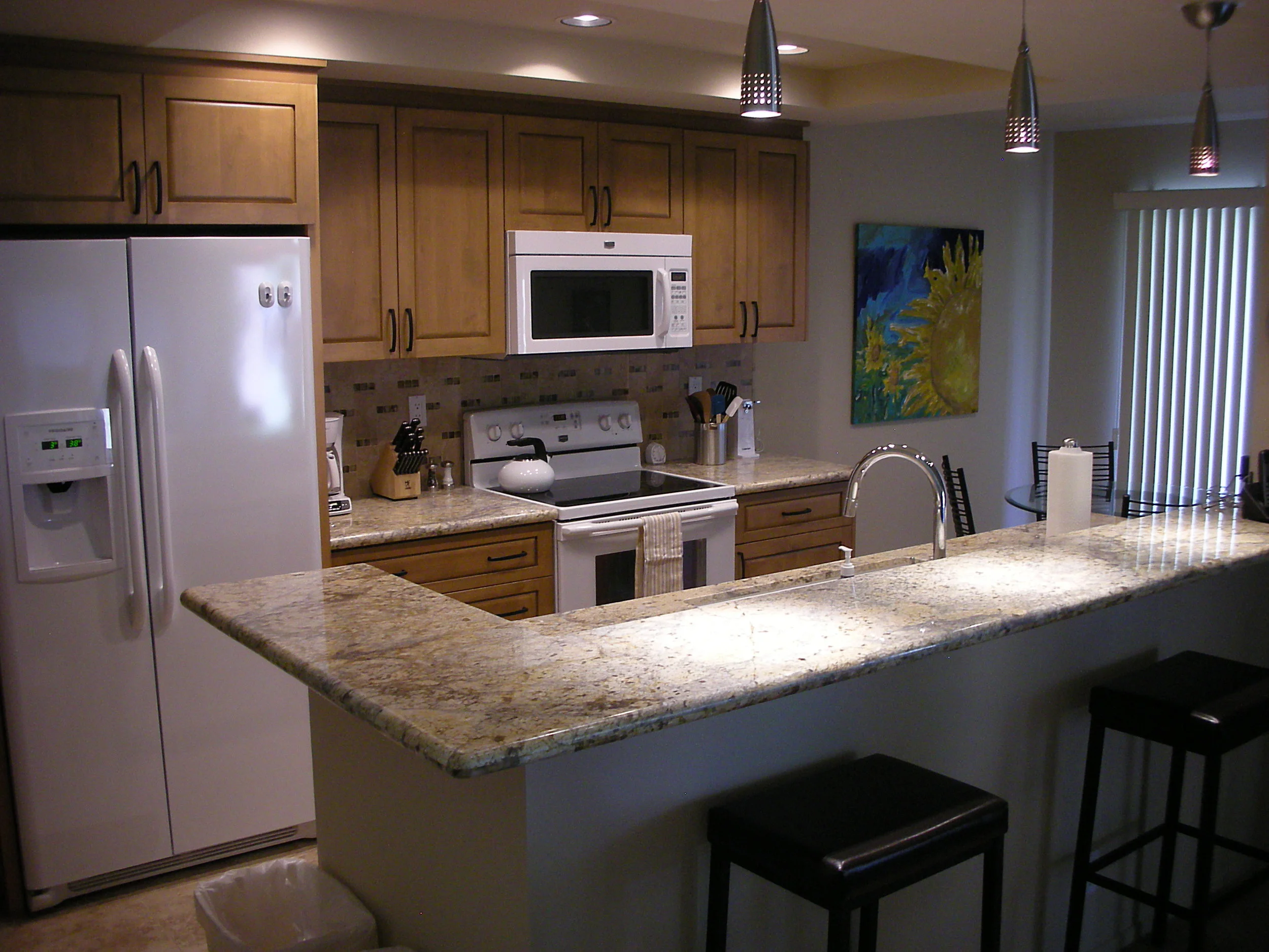 Remodeled kitchen with granite countertops, new appliances and breakfast room