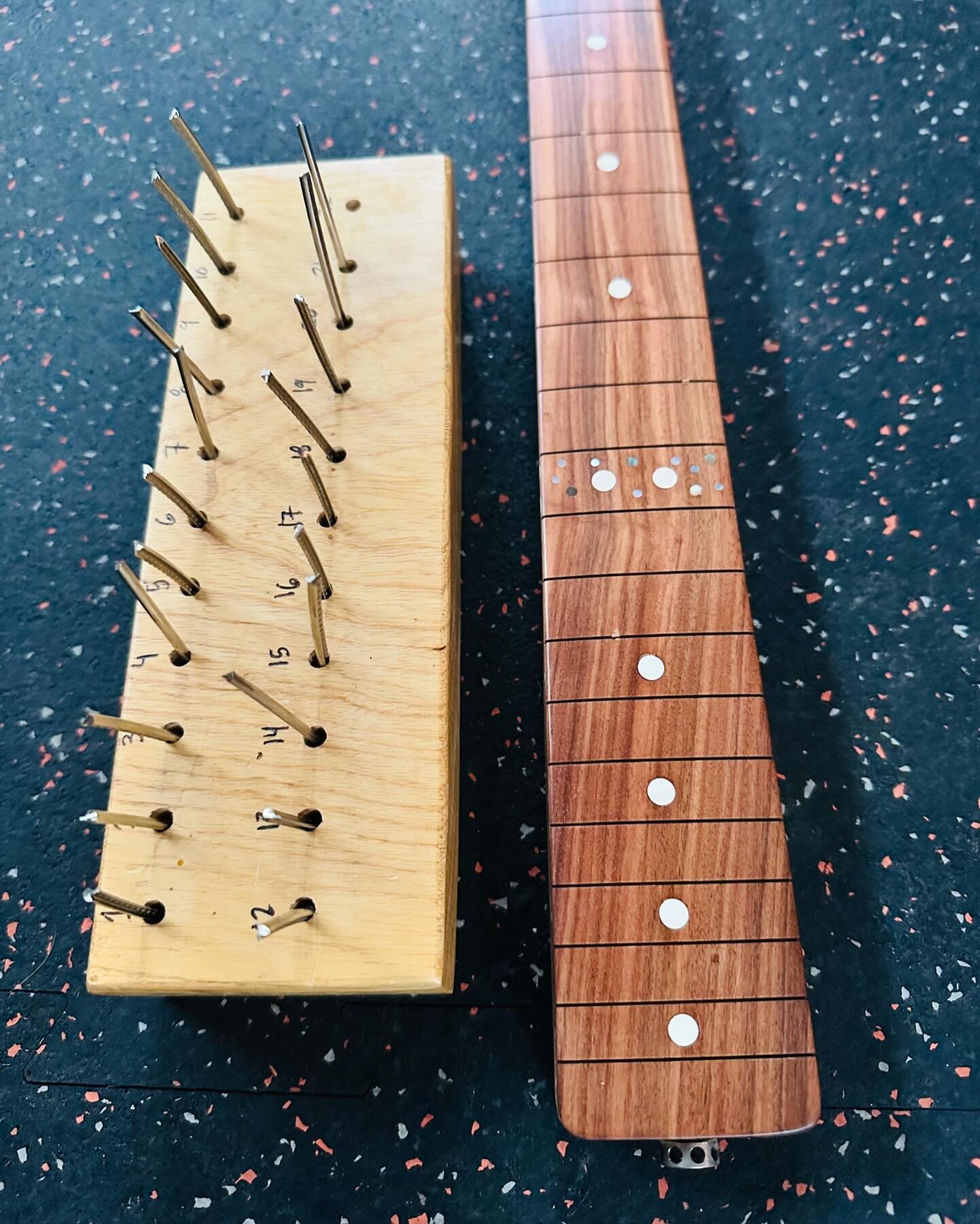 While chambering an unimaginably dense piece of Honduran mahogany, my router just sort of shuddered to a stop, so I moved on to one of my favorite tasks: fretting.  There is something so pleasing about the thonk of cutting wire, the hammer driving th