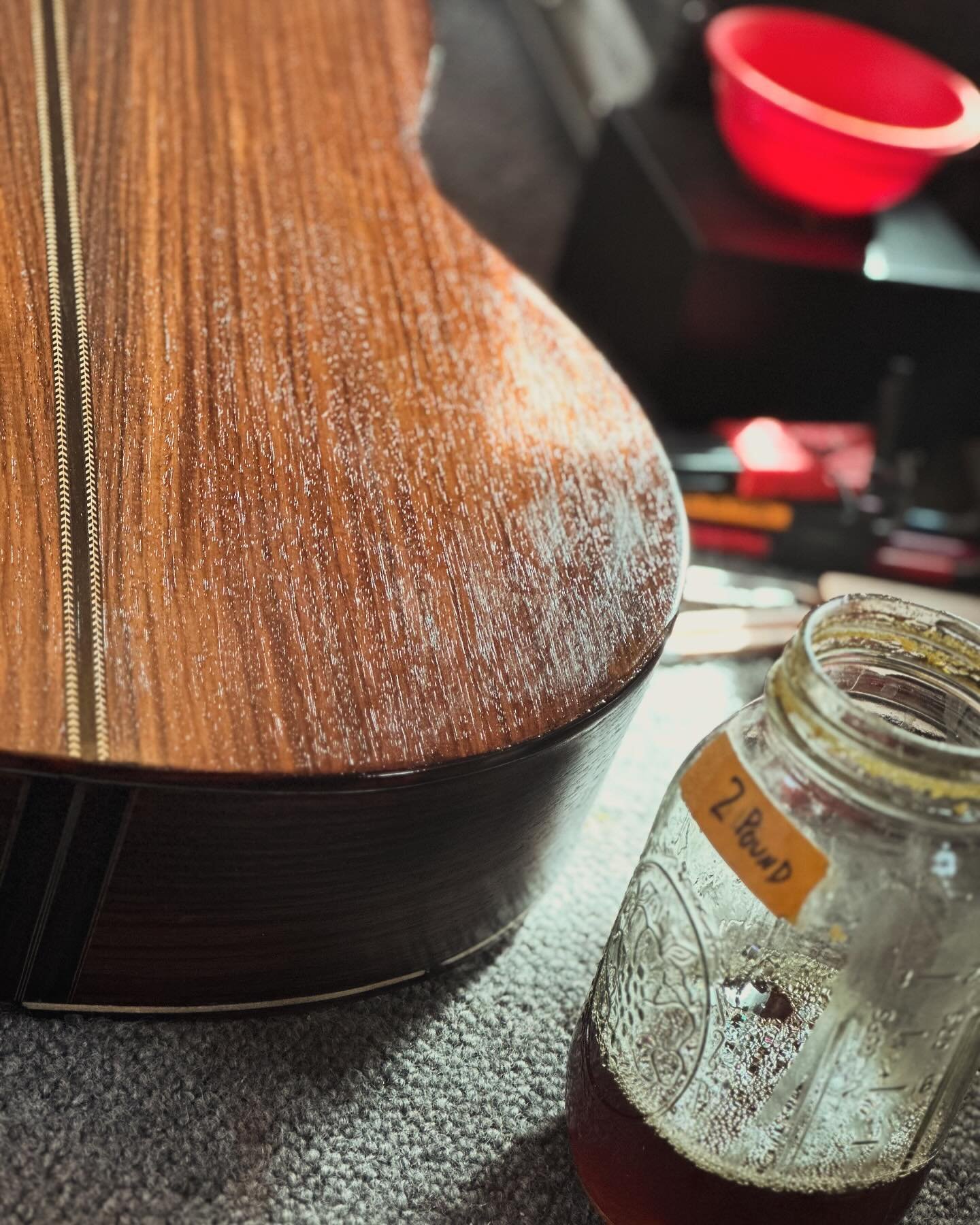 I apply a few quick coats of shellac to protect the sides and back from small scrapes before gluing down the bridge and fingerboard.  This set (lutherie term for sides and back) is particularly pleasing.