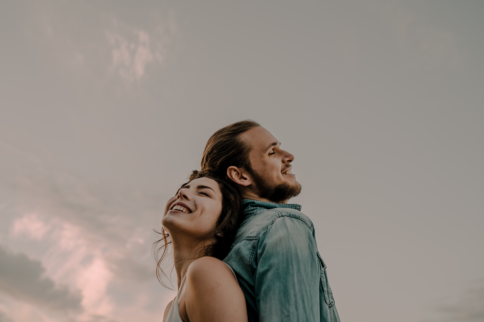 couple laughing during an engagement session in islandmagee