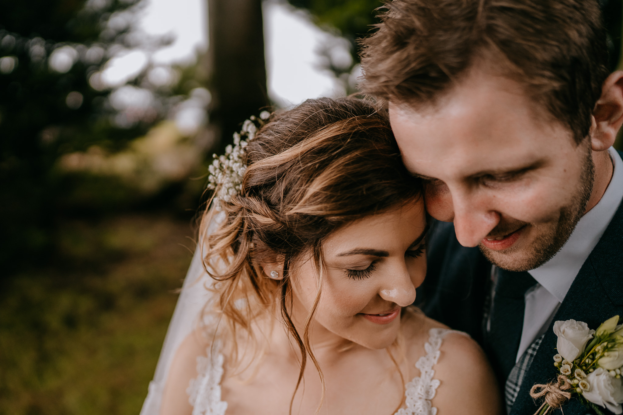  beautiful moment between bride and groom in secret garden Northern Ireland wedding photographers 