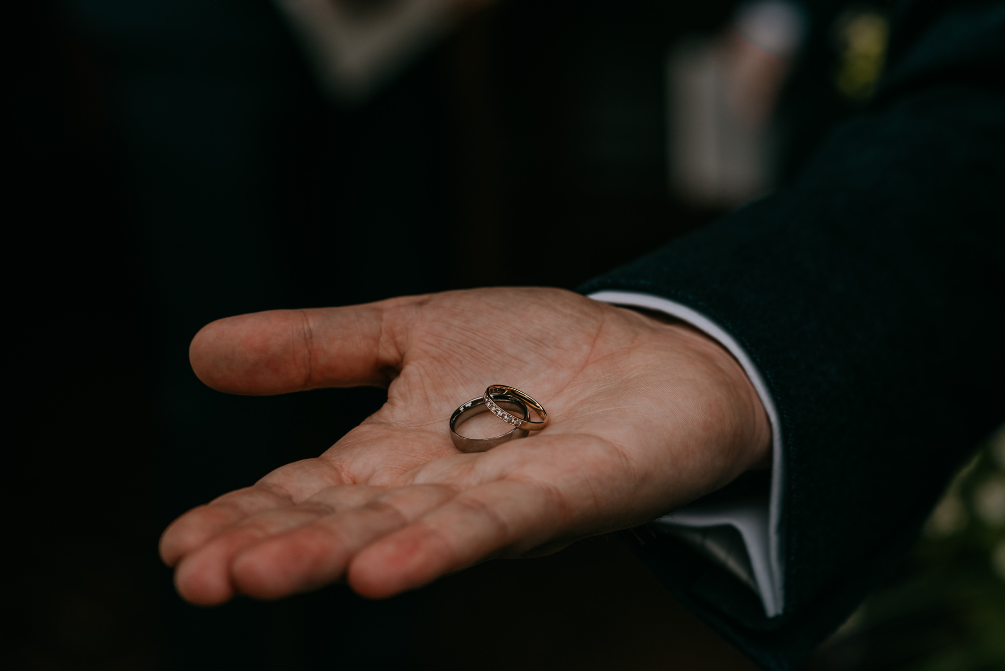 groom holding wedding rings in palm Northern Ireland Wedding Photographers