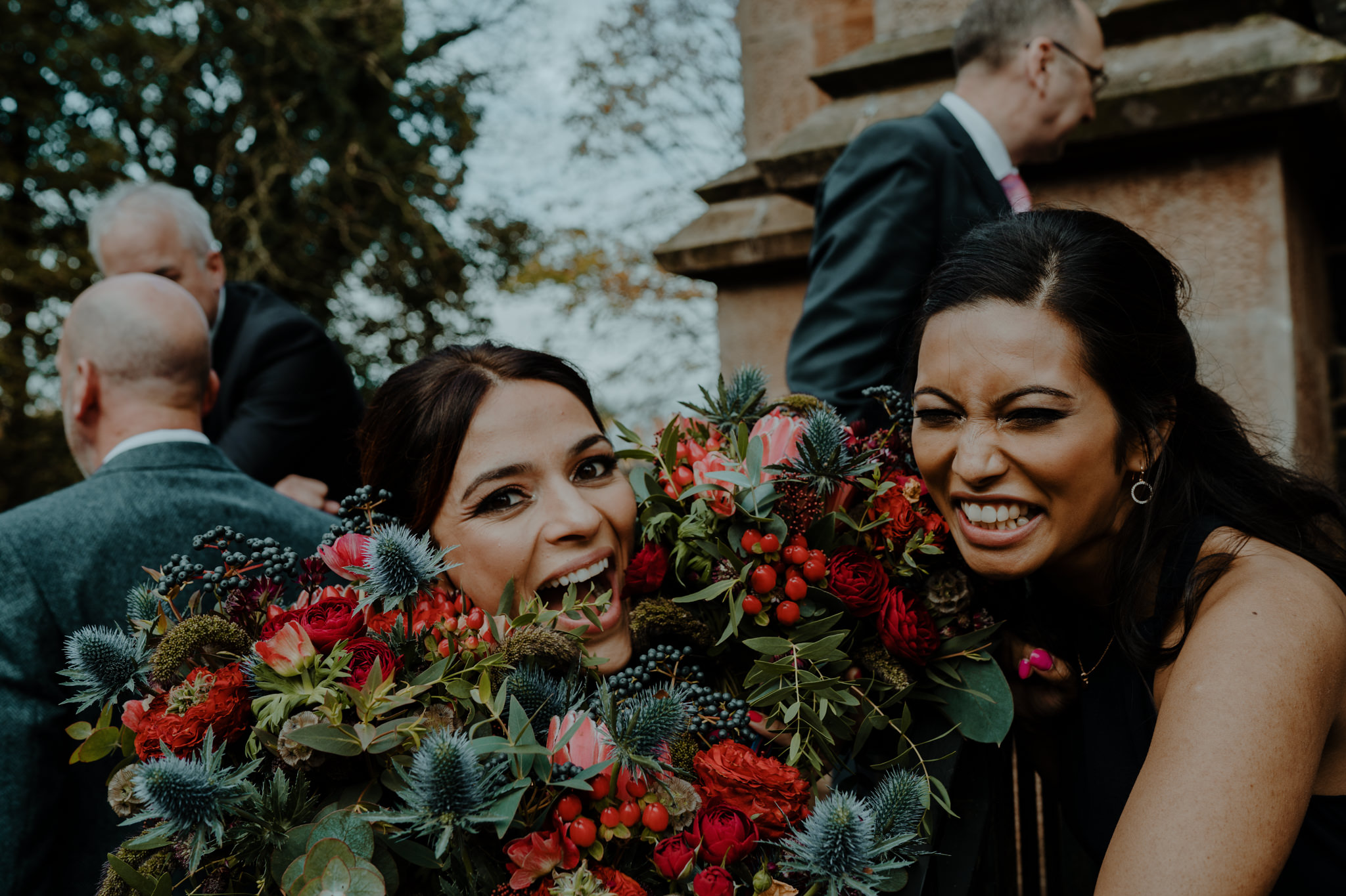 bridesmaids having fun with flowers  wedding at lissanoure castle