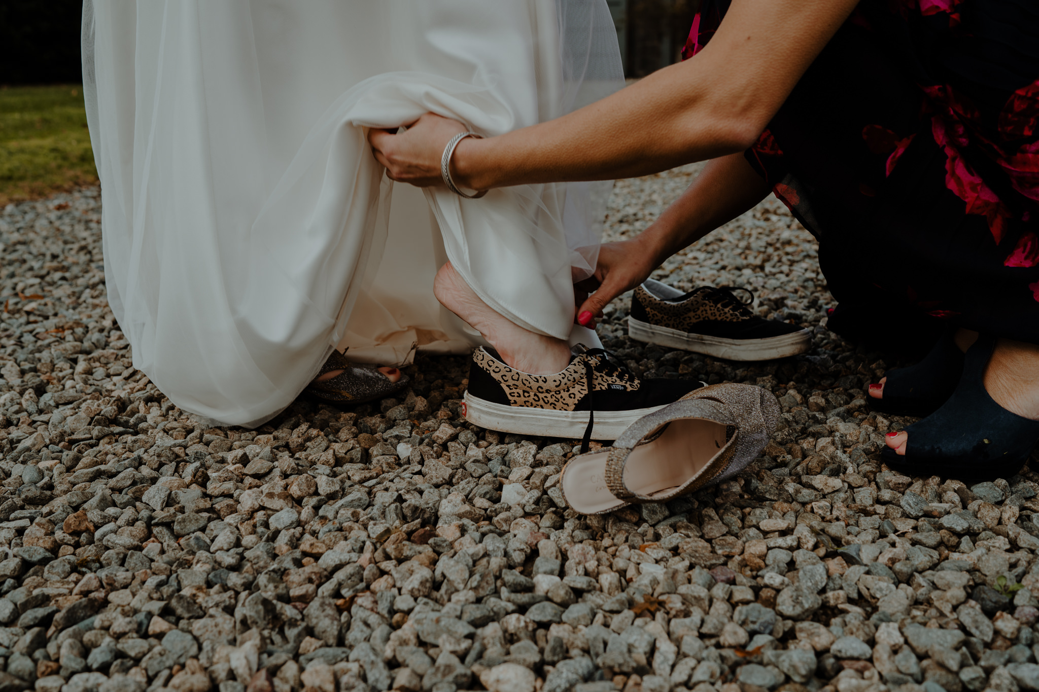 bride puts on vans  wedding at lissanoure castle