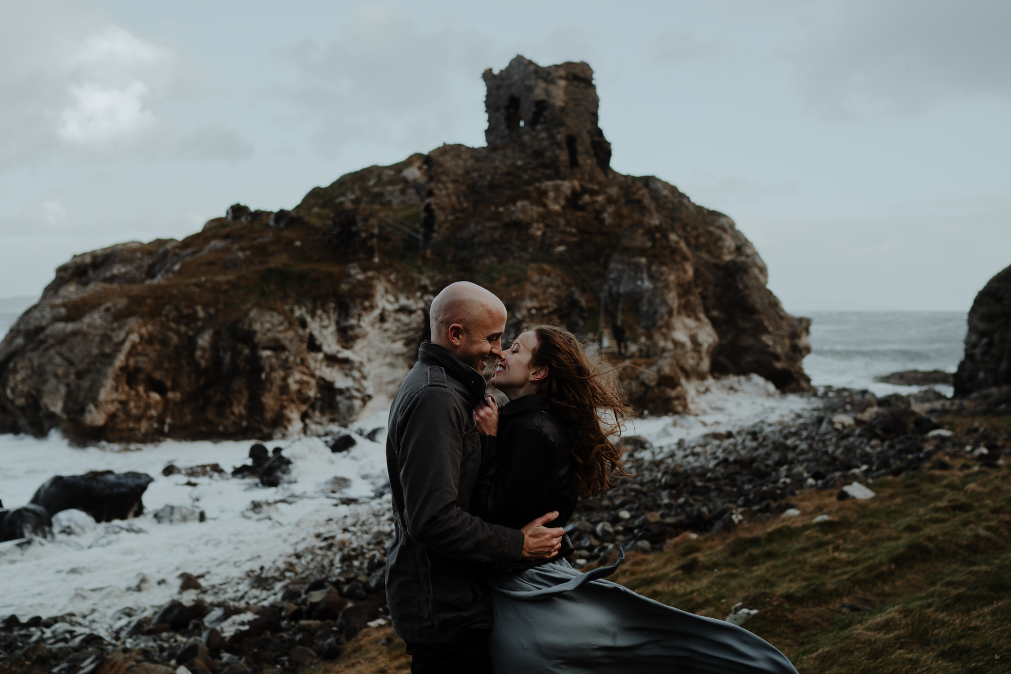 adventure travel ireland castle north coast kissing couple