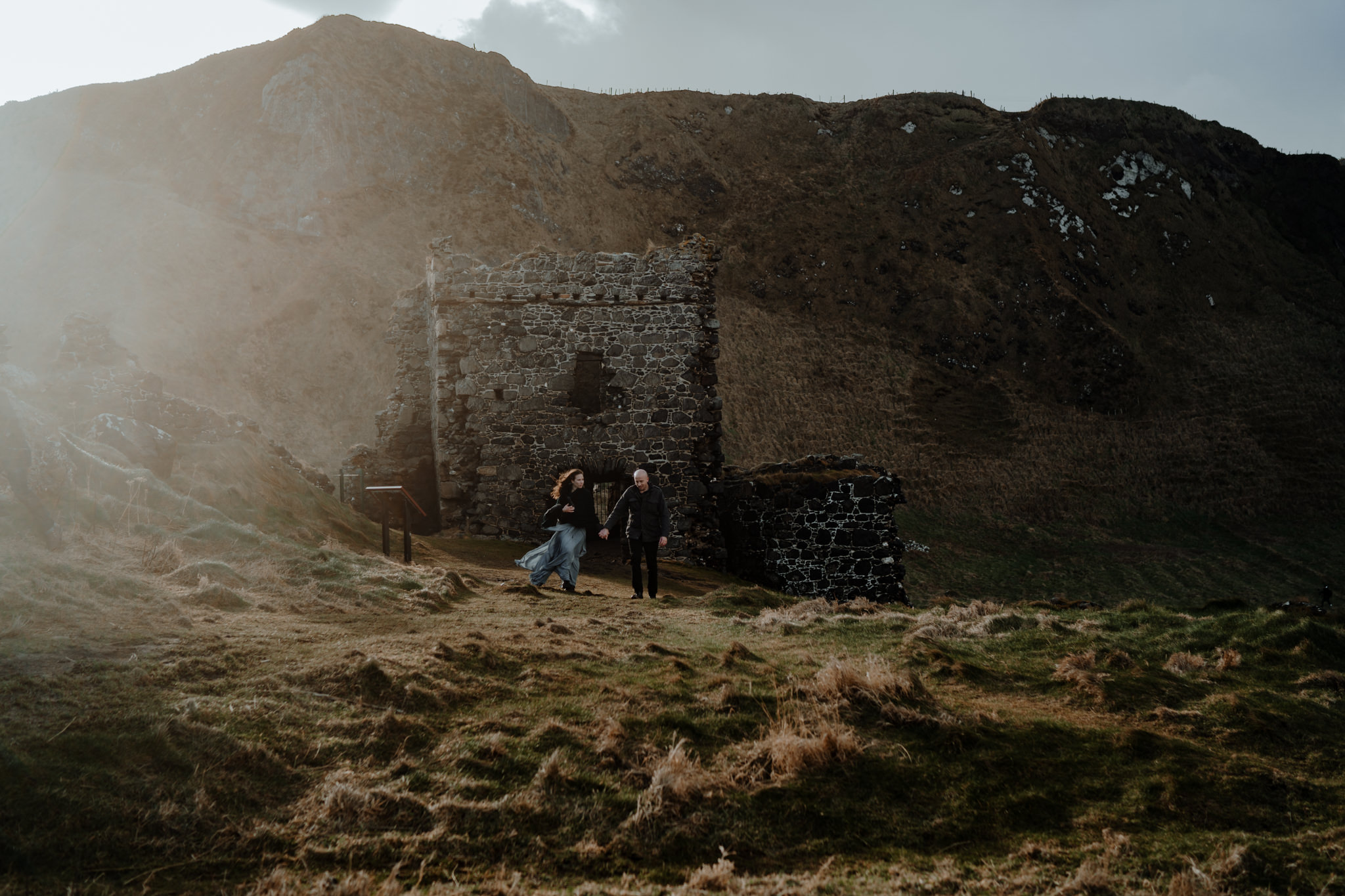 sunset at kinbane castle elopement photographers ireland wanderlust