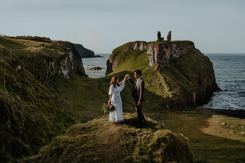 Cute couple twirl romantic endgame to photos Dunseverick castle northern irrland